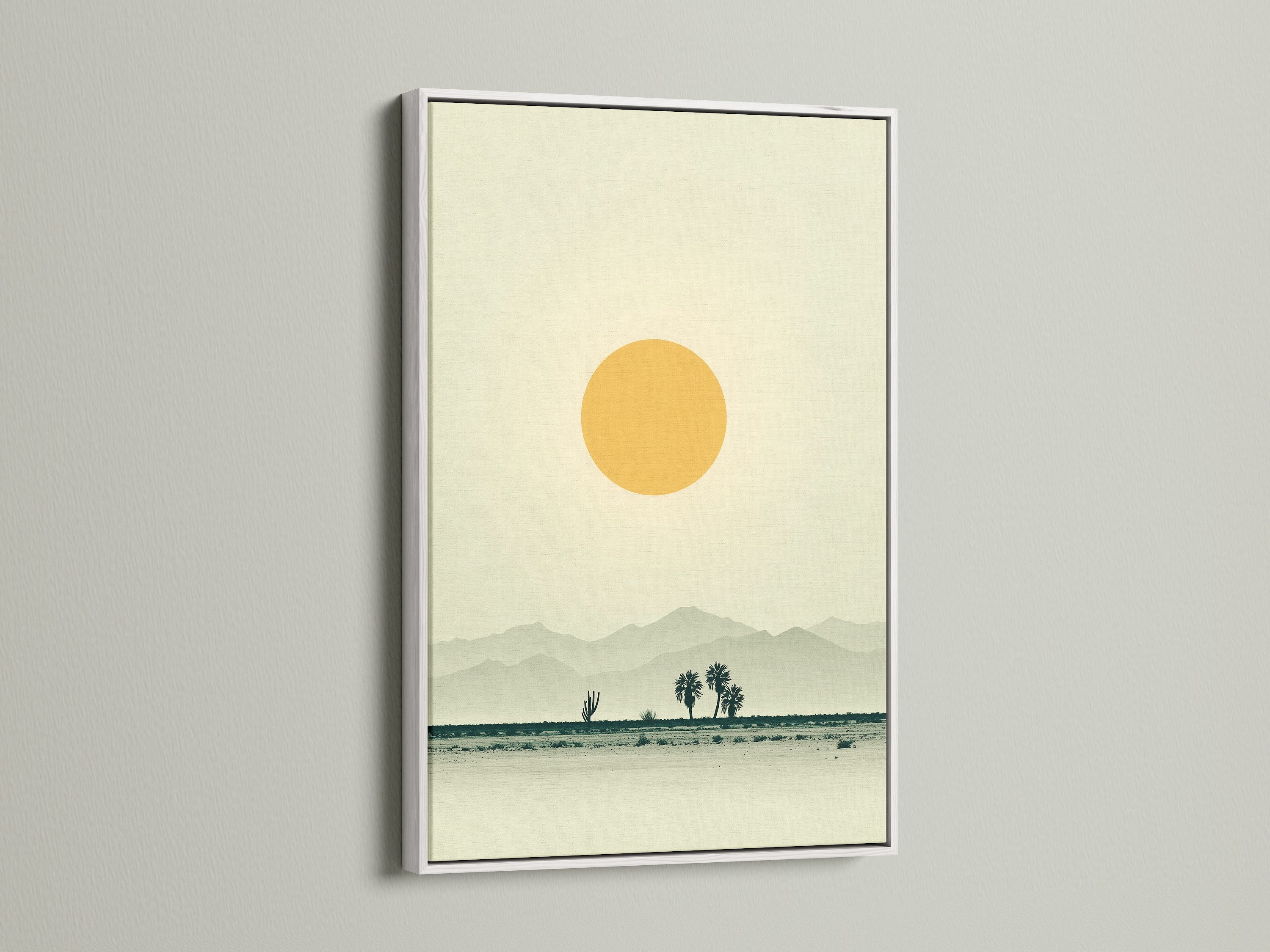 A desert landscape canvas print is displayed in a white frame. The warm earth tones of the artwork enhance any room. It is minimalist wall art. This print brings southwestern decor to a home office. It creates a calming and inviting atmosphere.