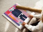 A woman is carefully rolling a fine art poster paper. The paper has a smooth texture. This ensures it is free of creases. The poster paper is perfect for high-quality prints. Preserve your art with professional materials. Fine art poster paper is ideal for detailed artwork.
