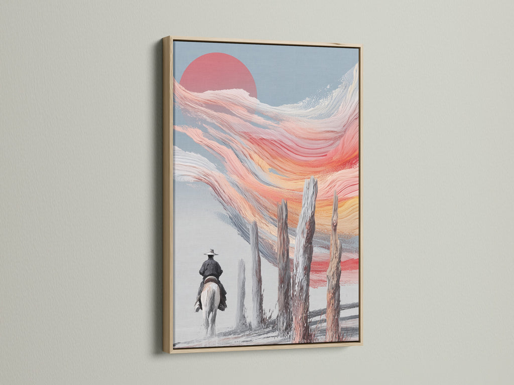 Cowboy sunset artwork framed in oak. This western landscape wall art captures a serene moment. The abstract horse riding artwork adds a touch of rustic charm to any room. A great piece for lovers of southwest art.