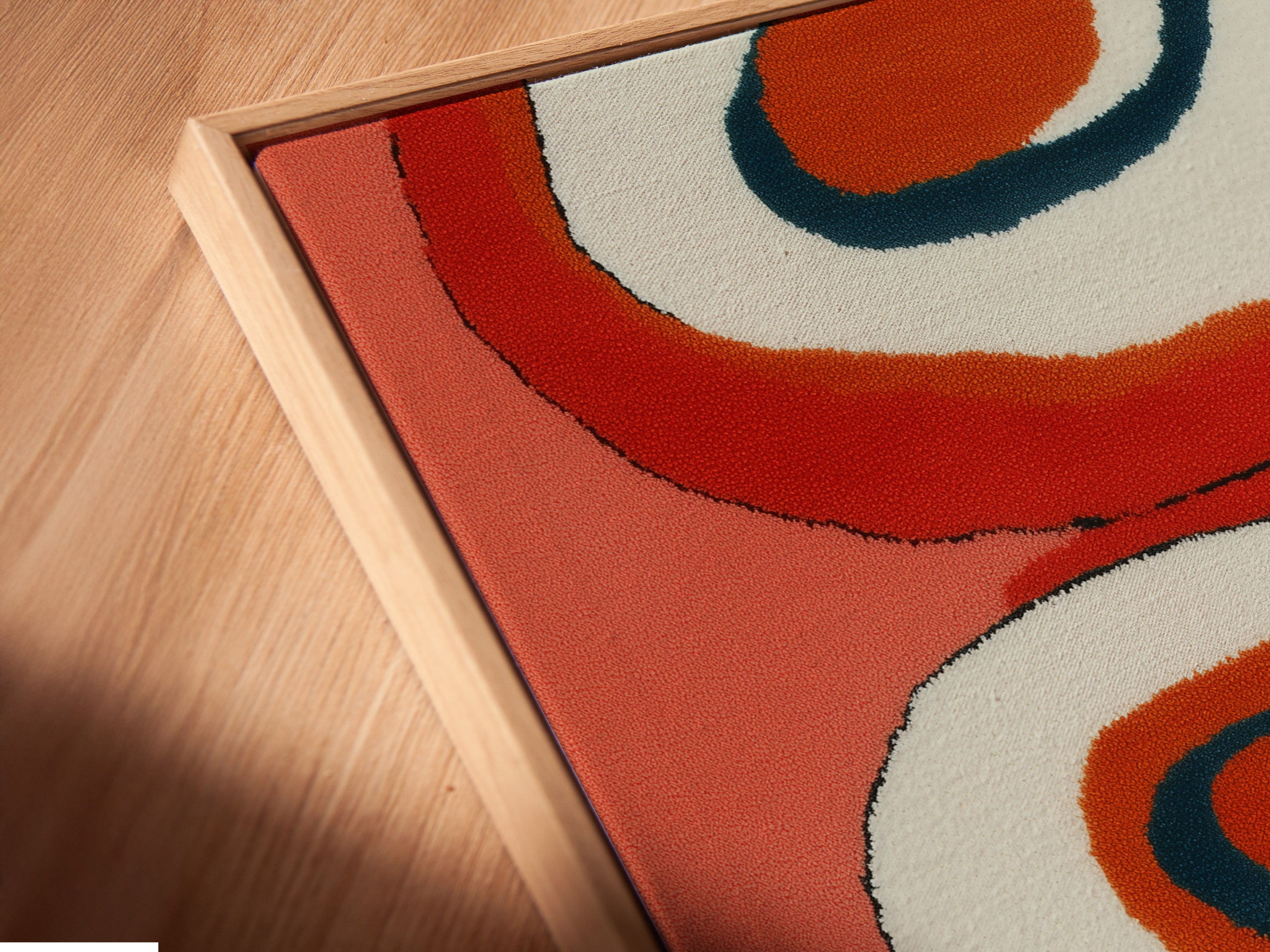 Get a closer look at this canvas print in a floating frame. The angled view highlights the mid-century abstract artwork. Notice the retro orange geometric style. Perfect for adding a touch of vintage modern decor to your home or office.