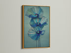 A gold frame brings a touch of elegance to this blue floral canvas print. The metallic finish enhances the modern botanical wall art. It creates a luxurious feel for your teal flower artwork in any room. This frame adds glamor