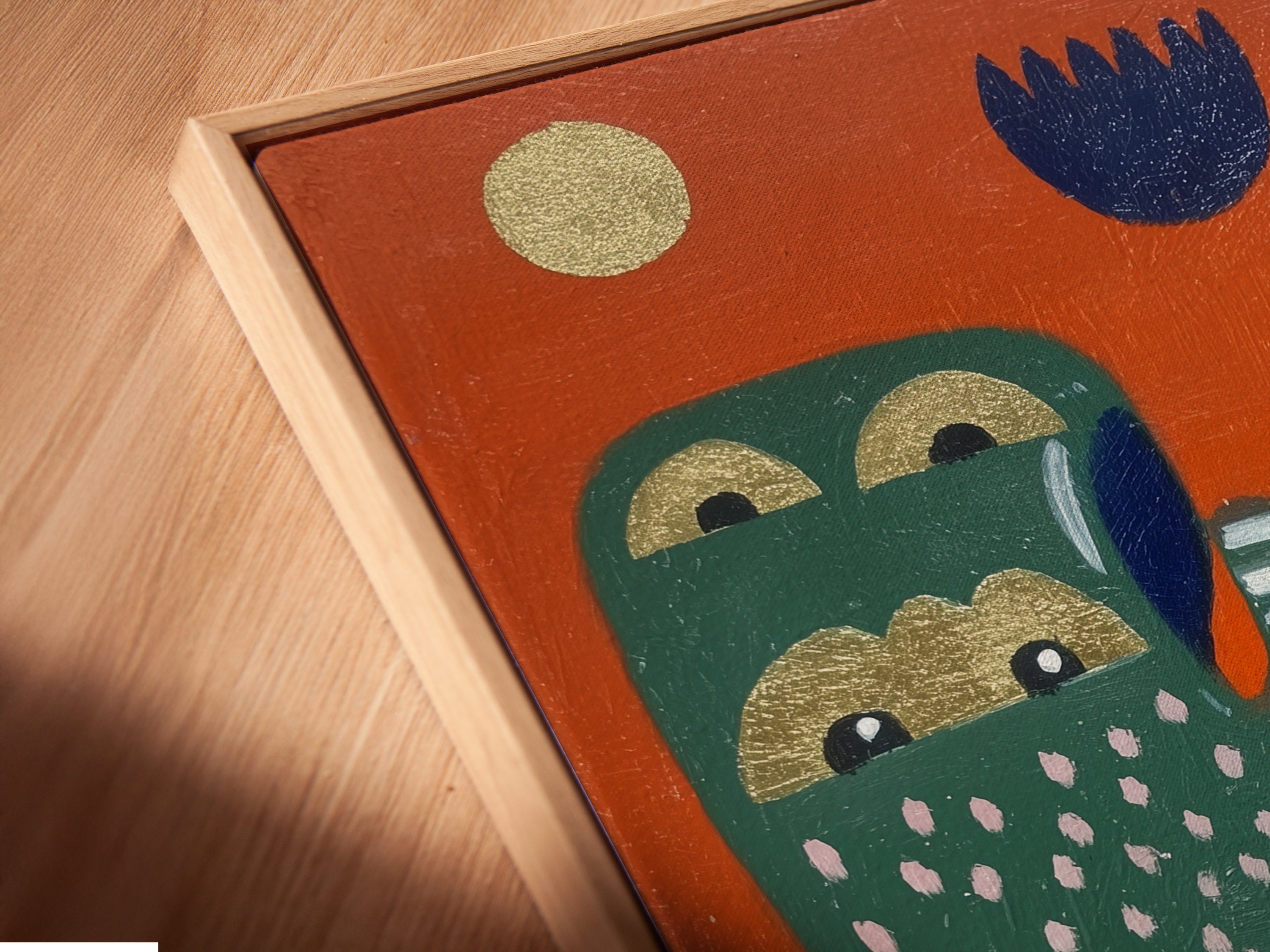 An angled close-up reveals a canvas print in a floating frame. The abstract hands artwork features colorful graphic elements. The floating frame gives the illusion of the artwork floating on the wall. It enhances the modern folk art style. Ideal for boutique wall decor and artistic spaces this print adds a unique touch.