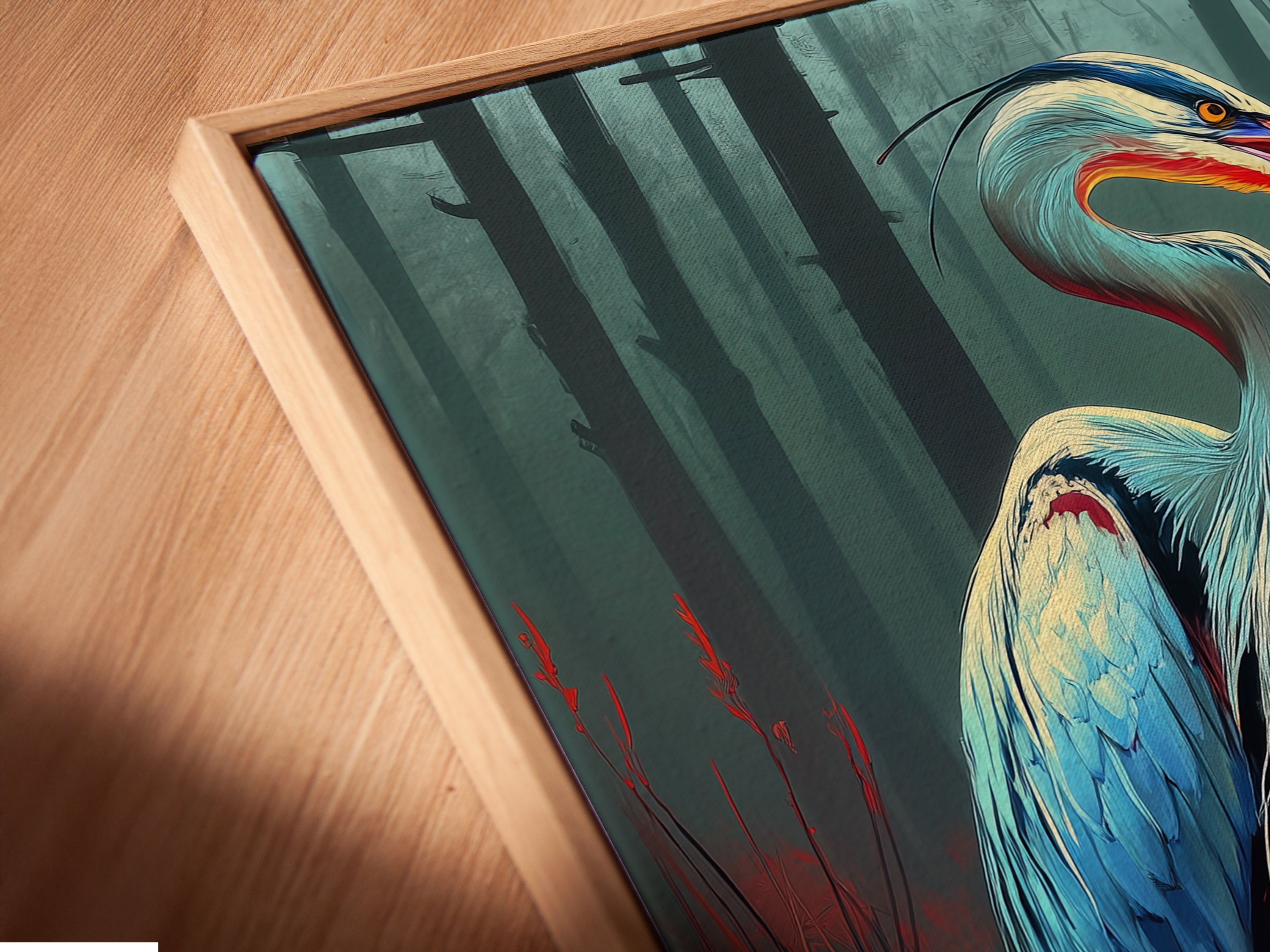 An angled close up reveals a canvas print in a floating frame. The heron artwork appears to hover creating a modern art effect. Teal and orange hues bring nature's beauty indoors. Ideal for those seeking unique office or home decor. This stylish heron canvas print enhances any room.