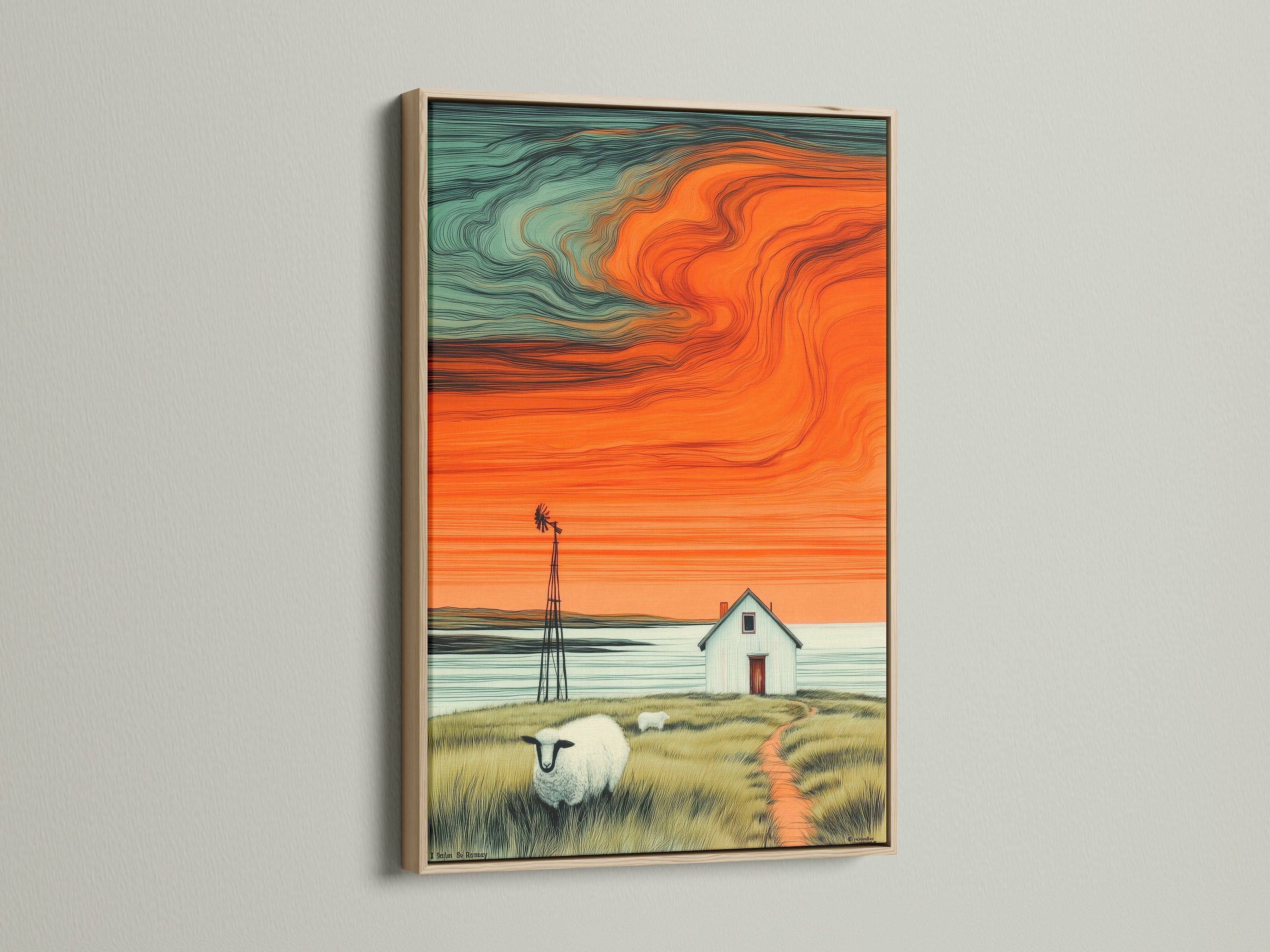 A calming farmhouse landscape canvas print is elegantly framed in oak. The artwork shows a windmill a quaint house sheep and a stunning orange sunset. This piece brings rustic charm to any room. It's perfect for cozy farmhouse decor.
