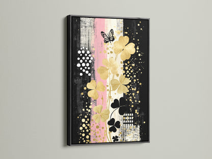 Clover Canvas Print art presented in a black frame. The bold frame complements the gold and black floral artwork. Elevate your space with this contemporary wall decor.