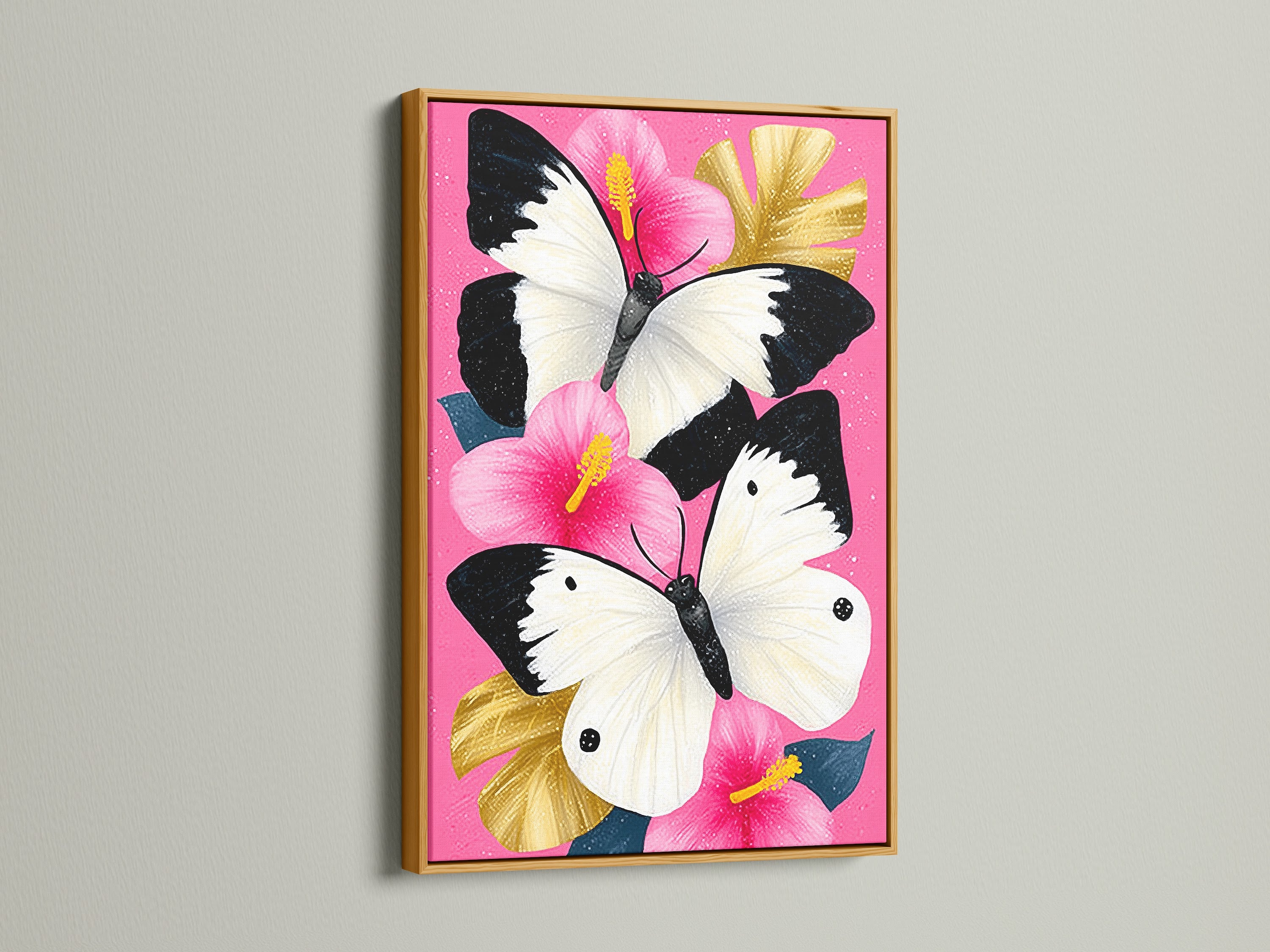 Butterfly Canvas Artwork with a Gold Frame. This stunning piece features a pink hibiscus wall art with white butterflies. Perfect for those seeking elevated wall decor. Add a touch of elegance to your living room or bedroom.