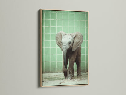 Baby Elephant canvas print in an oak frame. A cute animal print adds charm to any kids room decor. This safari animal art is ideal for a neutral tone nursery. Enhance your space with our elephant art.