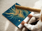 A woman carefully rolls a fine art poster paper. The dragon fantasy art print is ready for framing. High-quality materials ensure a stunning finish. Perfect for creating mystical wall art. Get your surreal ocean canvas print today. Add a touch of fantasy to your home.