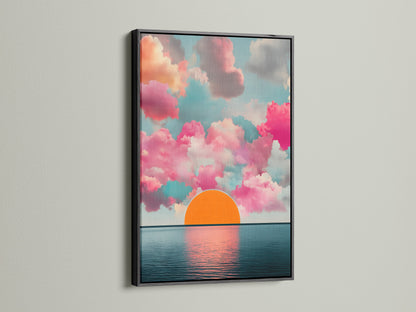 The Sunset Clouds artwork is displayed in a black frame. This modern artwork features pink clouds and a calming horizon print. The seascape canvas is perfect for living room wall art. Add a touch of sunrise art to your home decor.