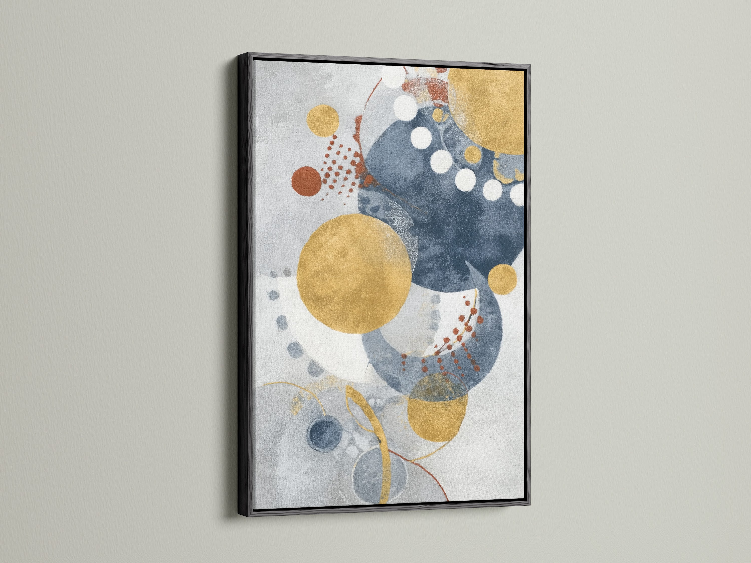 Modern geometric wall art in a black frame adds a touch of sophistication. The abstract artwork features blue and gold circles. Elevate your space with this contemporary print.