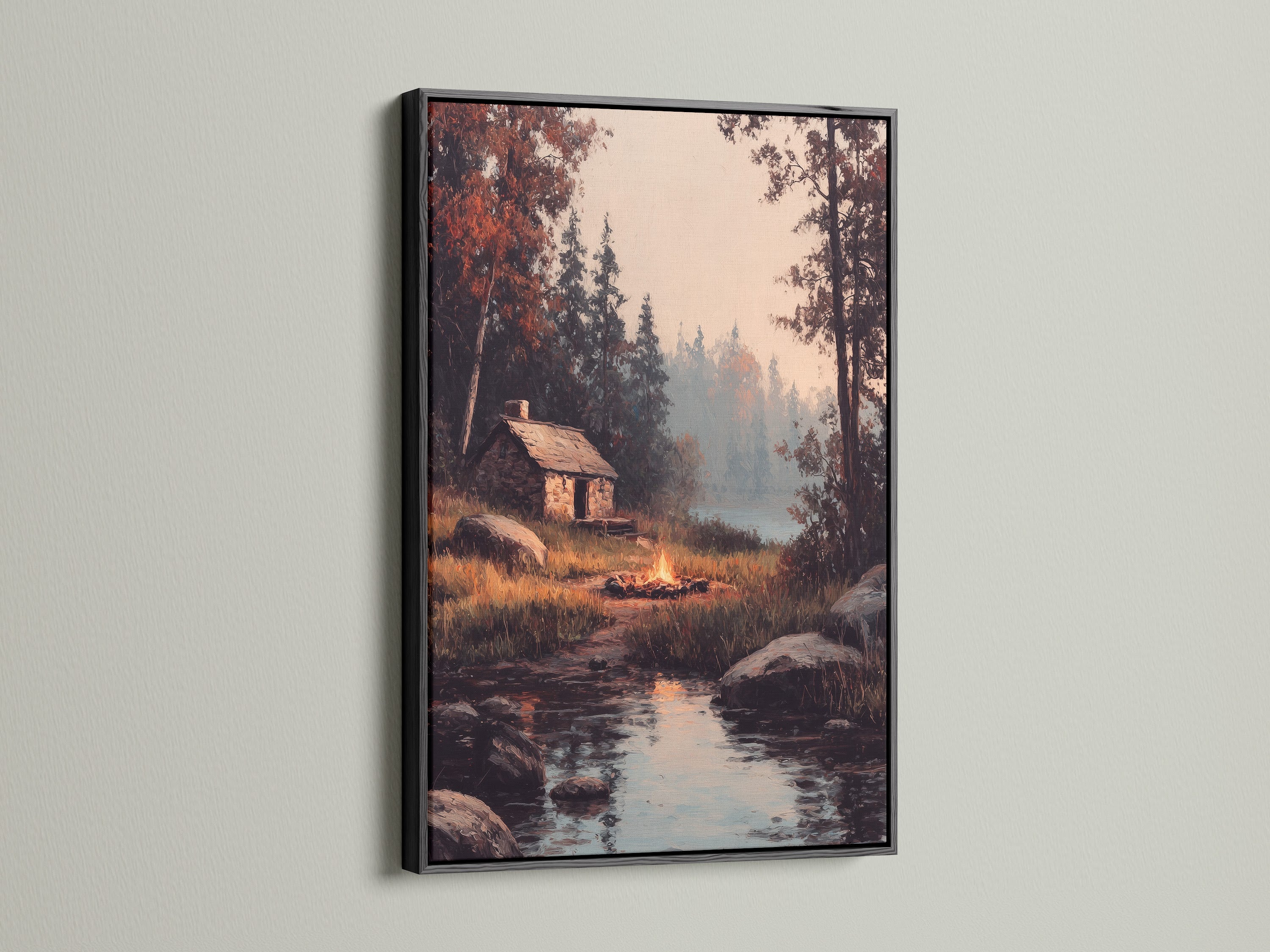 A black frame surrounds artwork of a cabin scene by a lake. The dark frame creates a striking contrast. Elevate your artwork with a sleek black frame. This frame is perfect for a modern aesthetic.