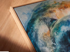 Close-up of a canvas print. The dolphin artwork is displayed in a floating frame. The floating frame gives a modern look. It enhances the artwork. Order your canvas print in a floating frame today