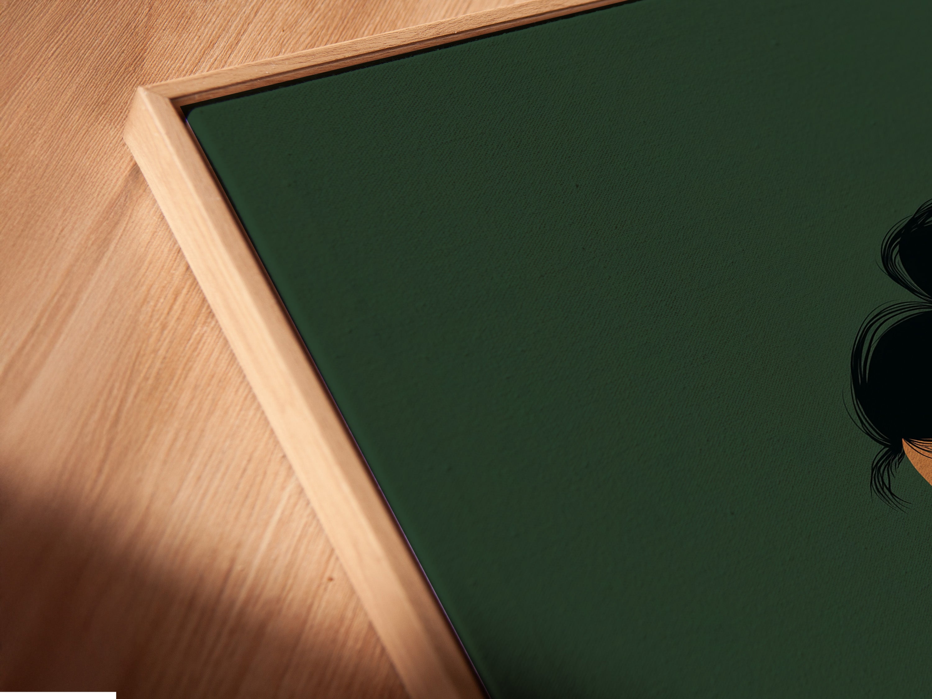 Angled close up of a canvas print in a floating frame. This artwork features a woman reading.  A serene sage green coffee wall art print. Ideal for adding a touch of tranquility to any space.