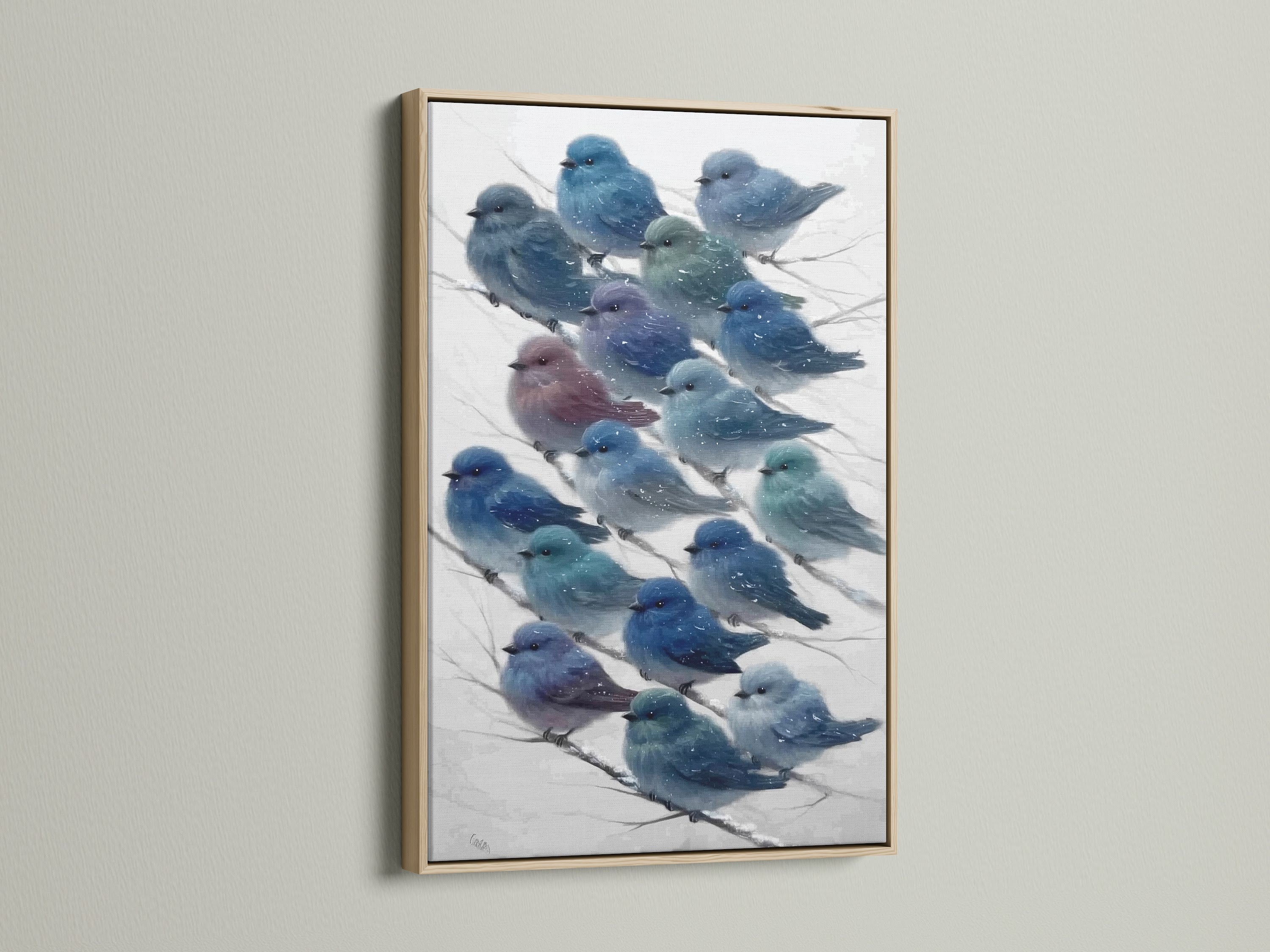 A framed canvas print showcases bluebird art in an oak frame. The winter bird wall art adds a cottagecore touch. The teal and indigo bird art complements eclectic home decor styles.