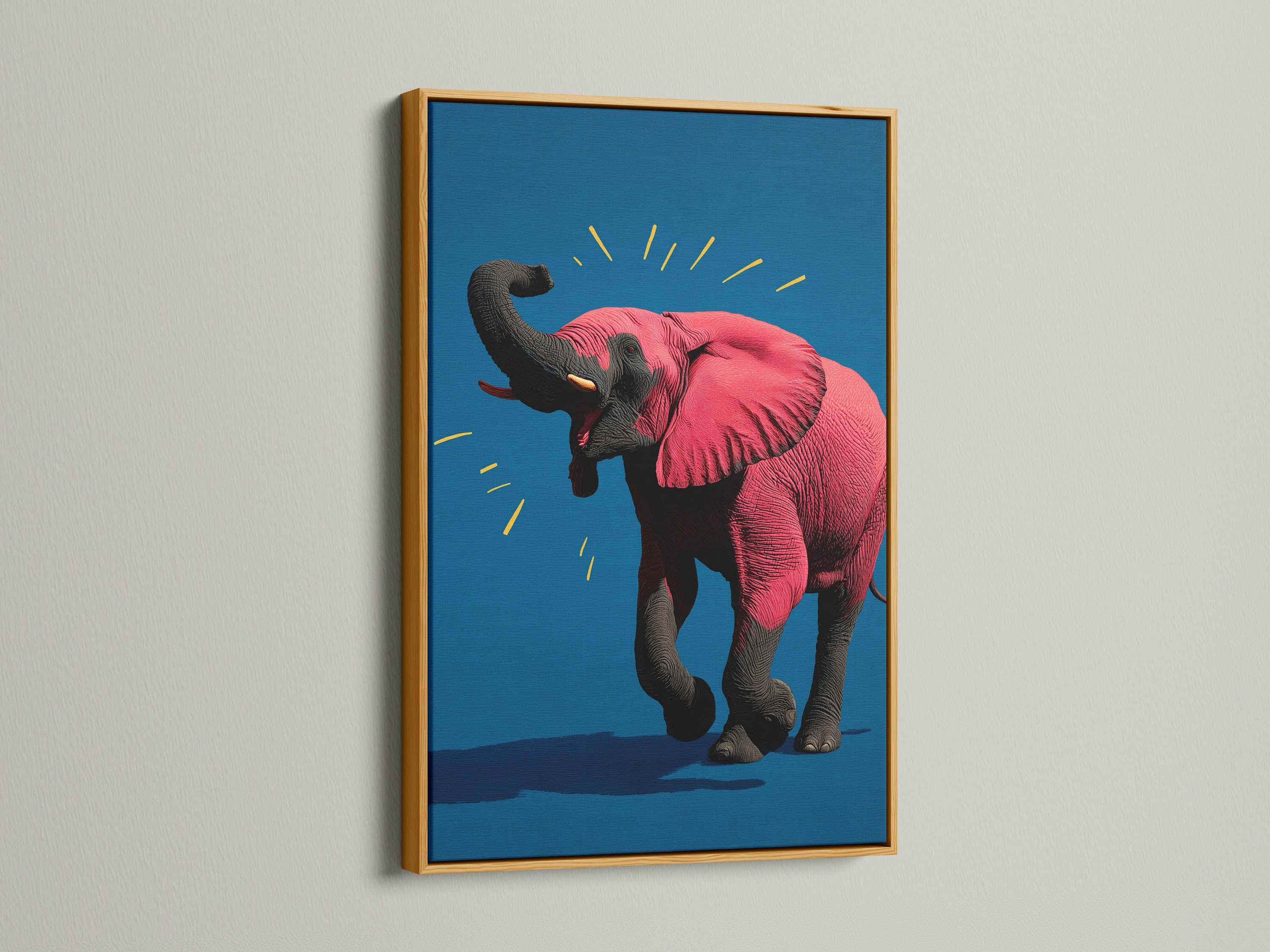 The pink elephant artwork is displayed in a luxurious gold frame. This contemporary animal canvas print brings a touch of elegance to any space. The vibrant pop art is perfect for adding a regal touch to a nursery or office. The gold frame enhances the artwork's vibrant colors.