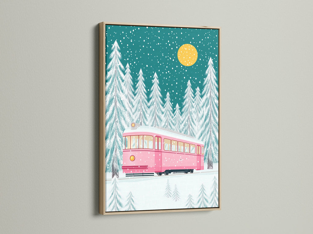 A charming pink tram artwork set against a snowy forest. The artwork is framed in a natural oak frame. This piece brings a cozy holiday feel to any space. It is a delightful addition to your festive decor or a thoughtful Christmas gift.