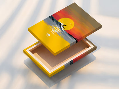 Discover the quality of our stretched canvas prints. This coastal artwork features a surfer riding a sunset wave. The stretched canvas enhances the artwork's texture. Ready to hang and enjoy this piece of ocean art. A great addition to any beach house.