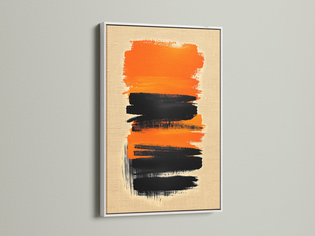 This Abstract Brush Stroke Art is displayed in a white frame. The contrasting black and orange colors make it a striking piece. Elevate your space with this modern wall art. See it in a white frame.