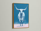 The longhorn bull artwork is featured in a gold frame. This piece of western artwork brings a touch of elegance to your space. The gold frame enhances the blue and pink hues. Perfect for a sophisticated look.