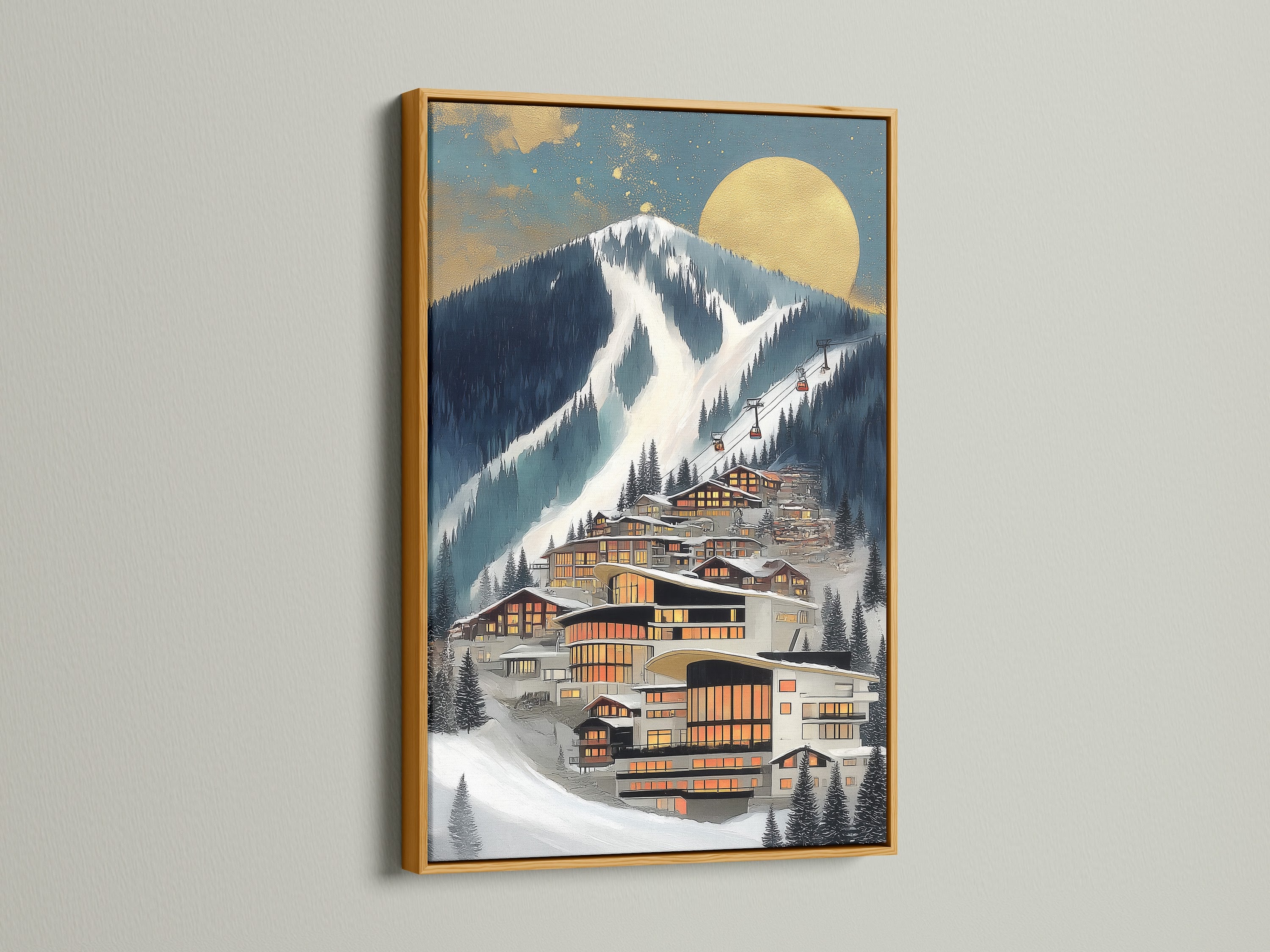 A framed Alpine Village artwork is displayed. The frame is gold. The wall art features a modern mountain ski resort. This contemporary canvas is ideal for interior decorators. It matches modern wall decor trends.