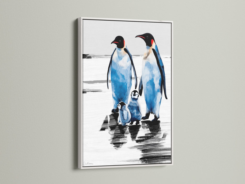 Penguin family portrait in a white frame. This animal artwork is a serene addition to nurseries or children's rooms. The blue and white winter wall art brings an antarctic ocean theme indoors.