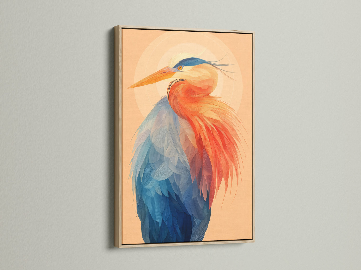 Close up of a framed heron art print in an oak frame. The coastal artwork features a vibrant blue and orange heron. A modern art print that is perfect for adding nature inspired elements to your home or office. The oak frame enhances the avian artwork.