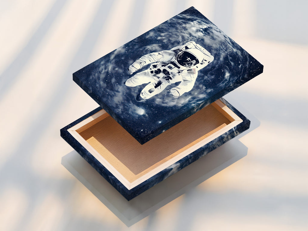 The stretched canvas print features astronaut space art with a blue galaxy backdrop. This ready-to-hang artwork is perfect for modern homes and offices. It enhances any space with cosmic beauty. A vintage NASA poster for collectors.