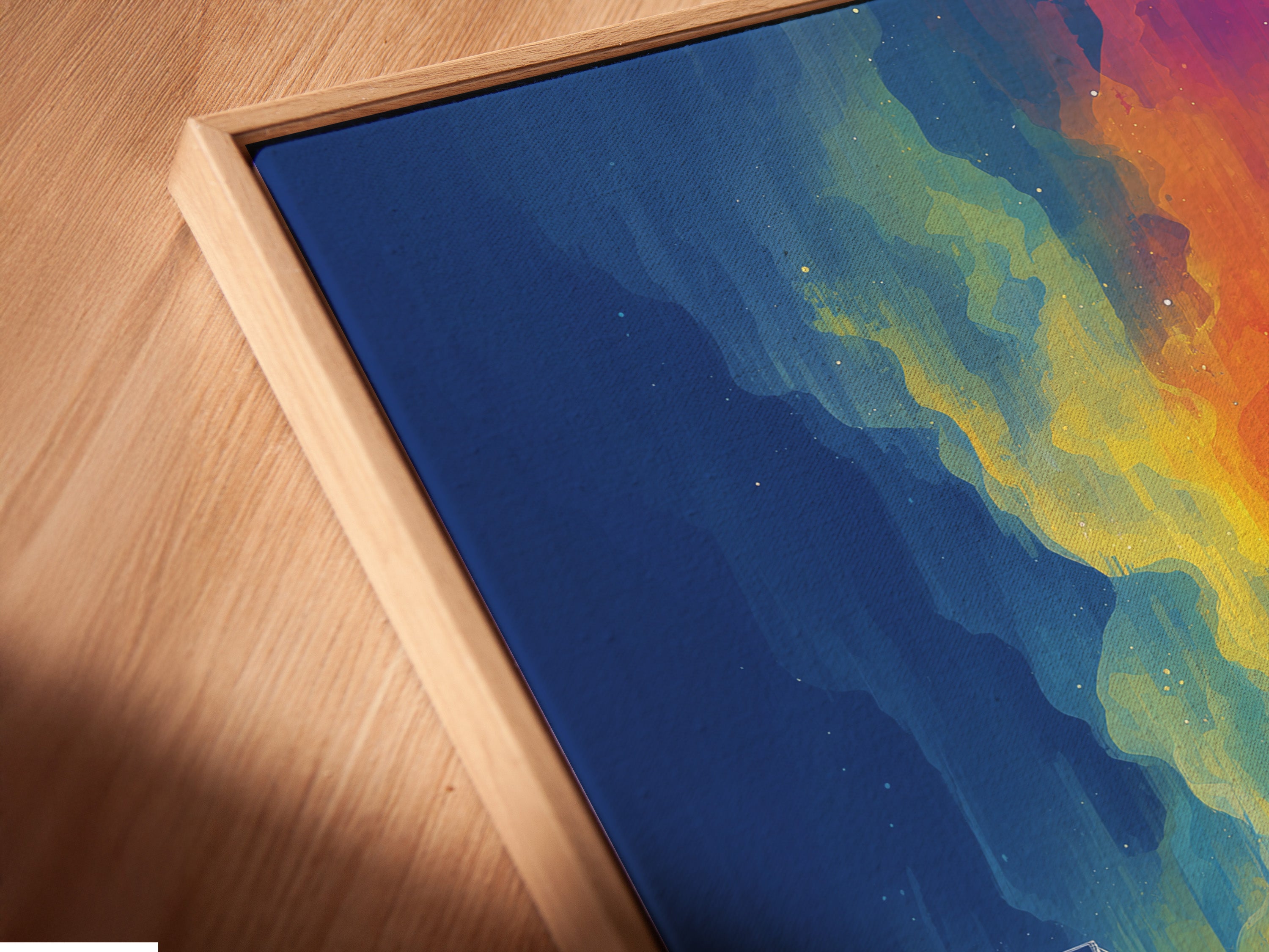 A close-up angled view of a canvas print in a floating frame. The artwork is a neon cityscape. The floating frame enhances the artwork's contemporary style. This urban wall art is perfect for modern interiors. The frame gives the art a sophisticated gallery-like appearance.