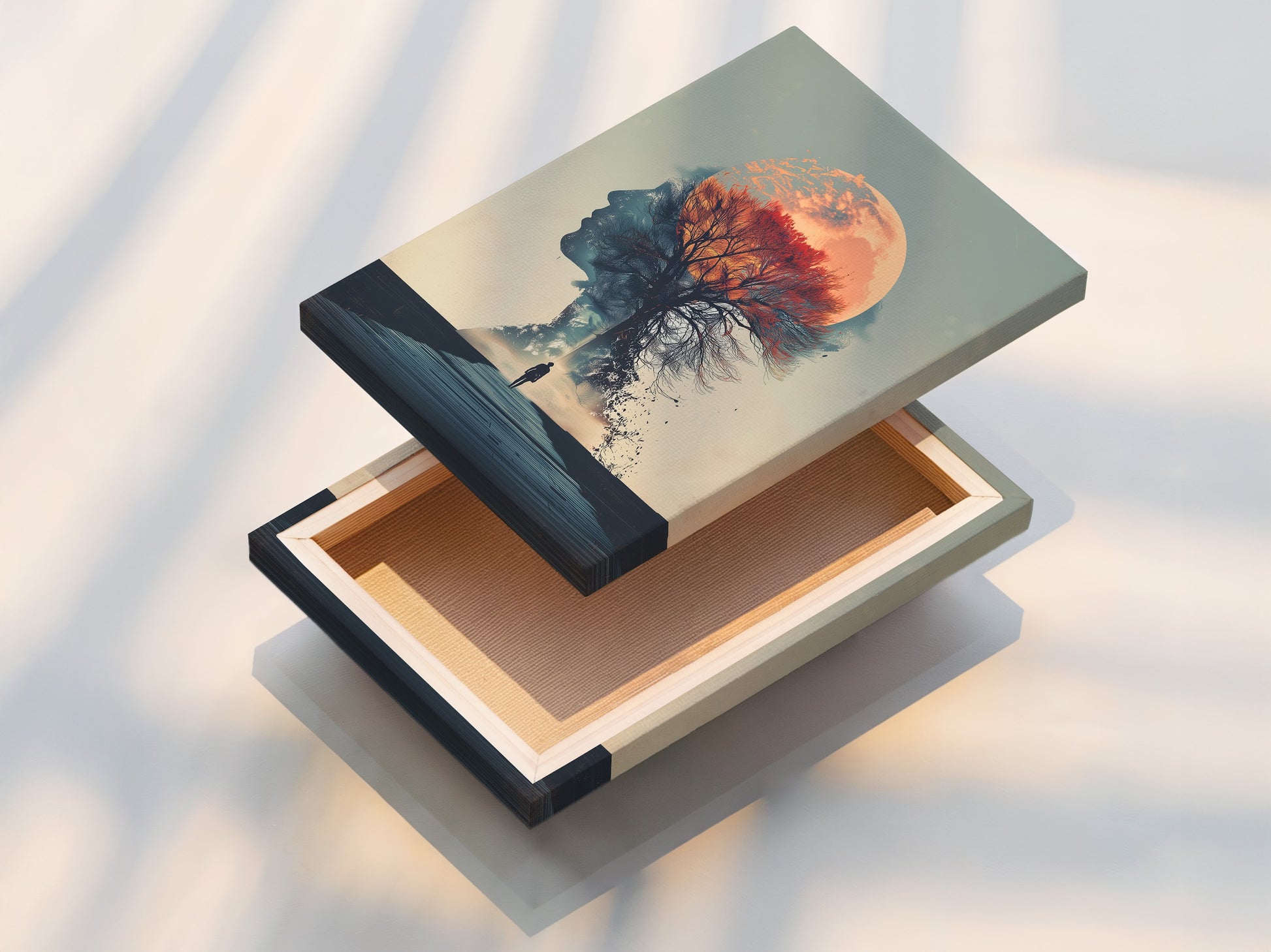 This stretched canvas print showcases a surreal double exposure artwork. The artwork blends a woman silhouette with a moon and a tree. Ready to hang this piece transforms any space. Ideal for modern minimalist and Scandinavian interiors.