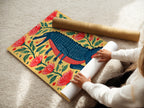 A woman carefully rolling a fine art poster paper. The paper features a colorful alligator artwork. This high-quality paper ensures vibrant colors and sharp details. Perfect for art collectors and enthusiasts.