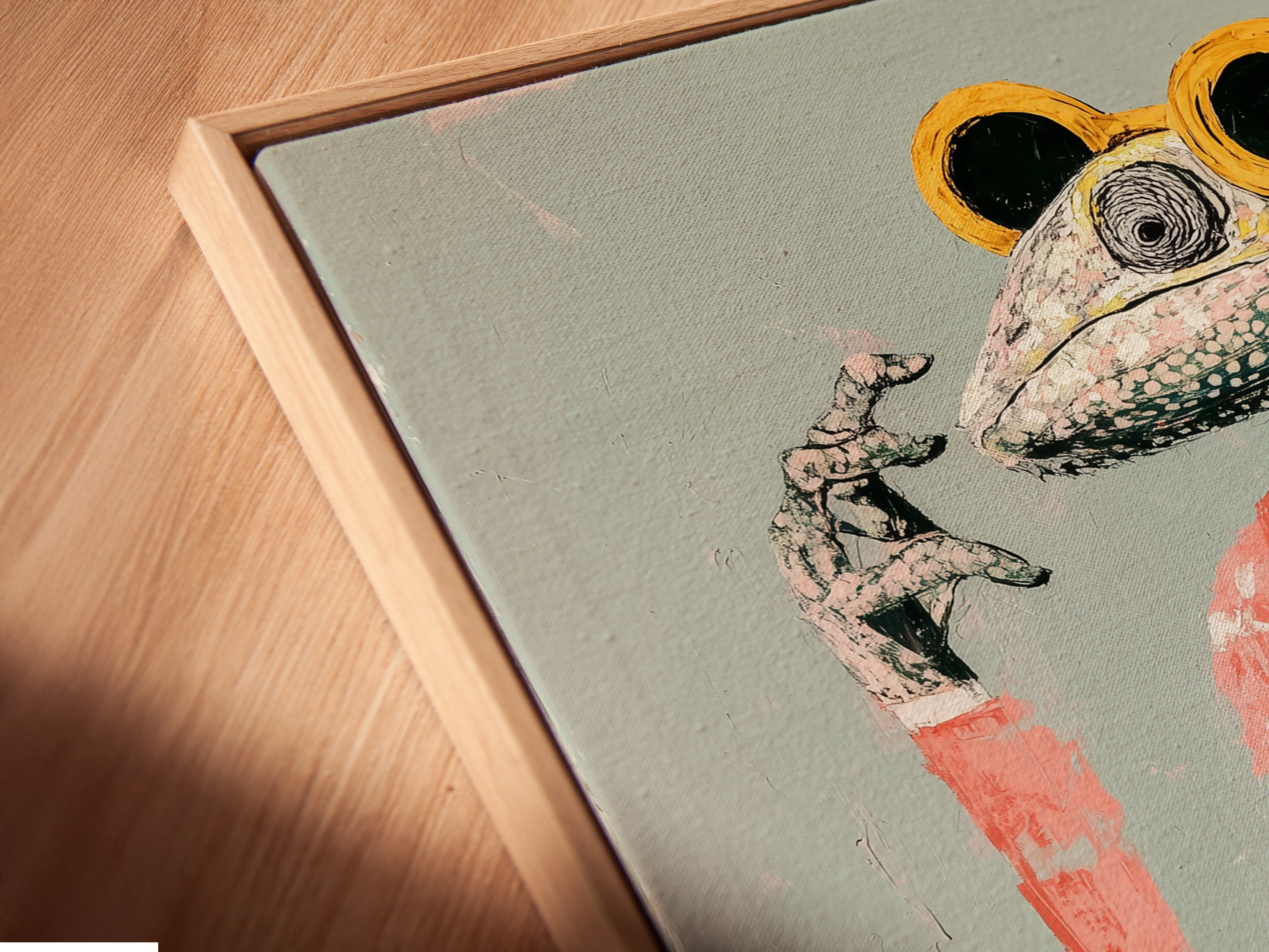 An angled close-up shows a canvas print of the Frog DJ art in a floating frame. The floating frame enhances the contemporary wall decor. The canvas print highlights the quirky animal artwork. Perfect for adding a unique touch to any room.