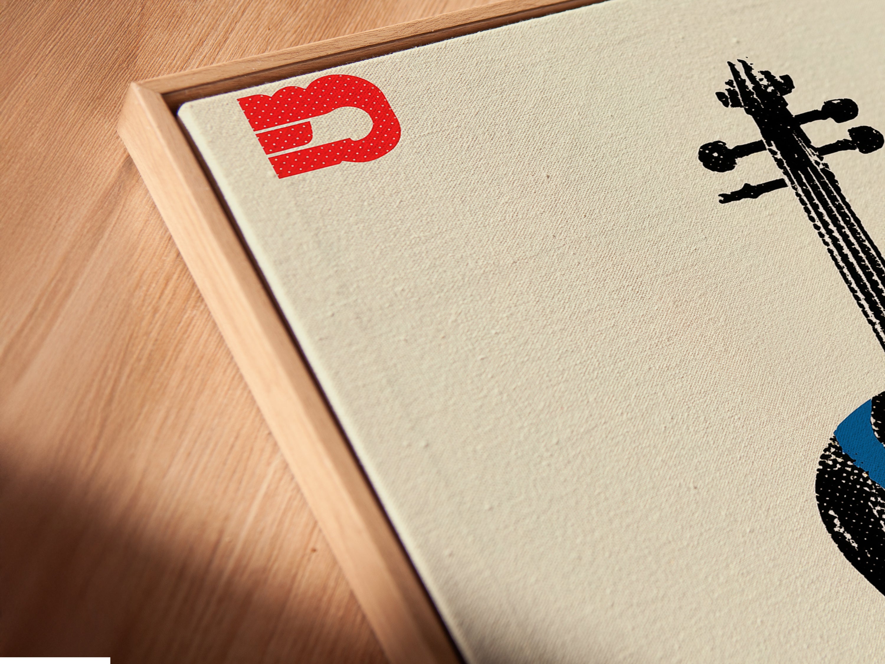 This is an angled close up of a canvas print in a floating frame. The abstract violin artwork is modern and eye catching. This colorful orchestra art is ideal for any music room. The floating frame adds a touch of sophistication