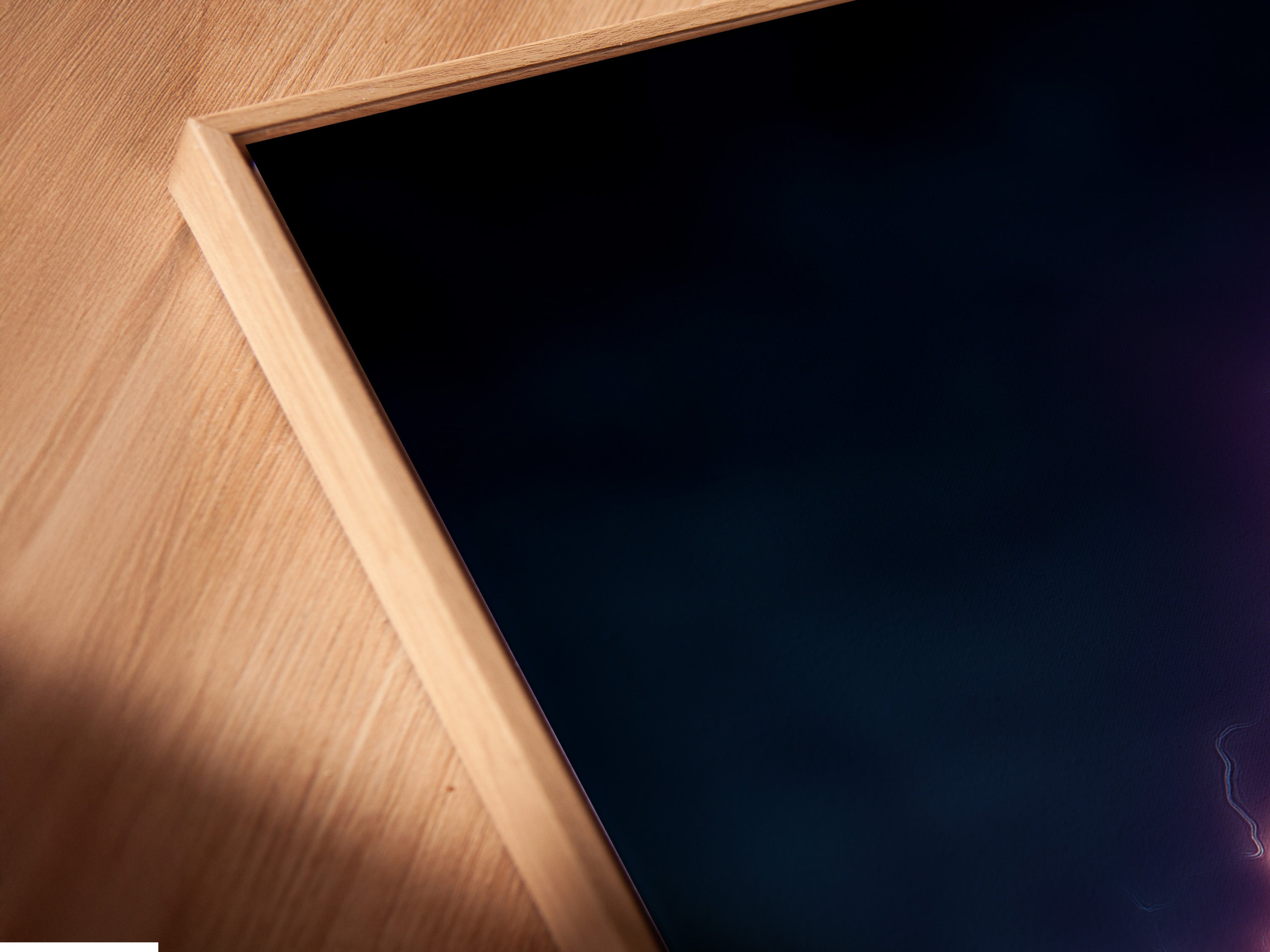 Close-up angled view of a Neon Dumbbell canvas print in a floating frame. The electric gym artwork enhances any home gym decor. This fitness motivation piece stands out. The floating frame gives a modern touch. Perfect for a contemporary fitness space.