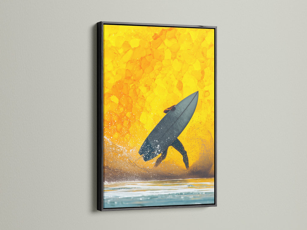 Surfing canvas print in a black frame. The artwork features a surfer silhouetted against a yellow sunset. The black frame adds a modern touch to this coastal decor. Ideal for creating an ocean theme in any room. This sunset art is perfect for beach house art.