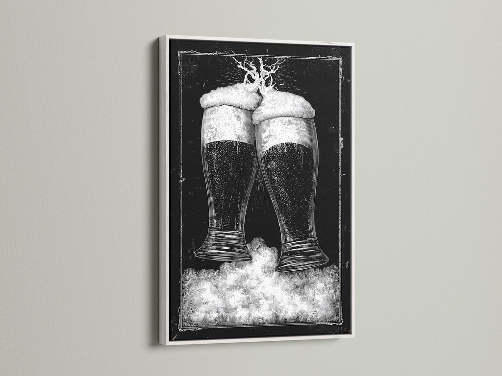 White frame artwork. The art features two beer glasses in black and white tones. This piece is mounted on a clean white wall. The frame is a crisp white color. Discover framed artwork options to enhance your space. Explore our selection today for the perfect piece.