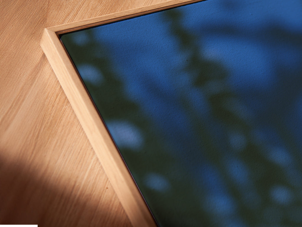 Get a close up view of a canvas print in a floating frame. The wolf art in the winter forest offers a stunning wildlife print. Ideal animal wall art for rustic home decor. This canine artwork and wolf photography will enhance any den or living space with its unique floating frame design