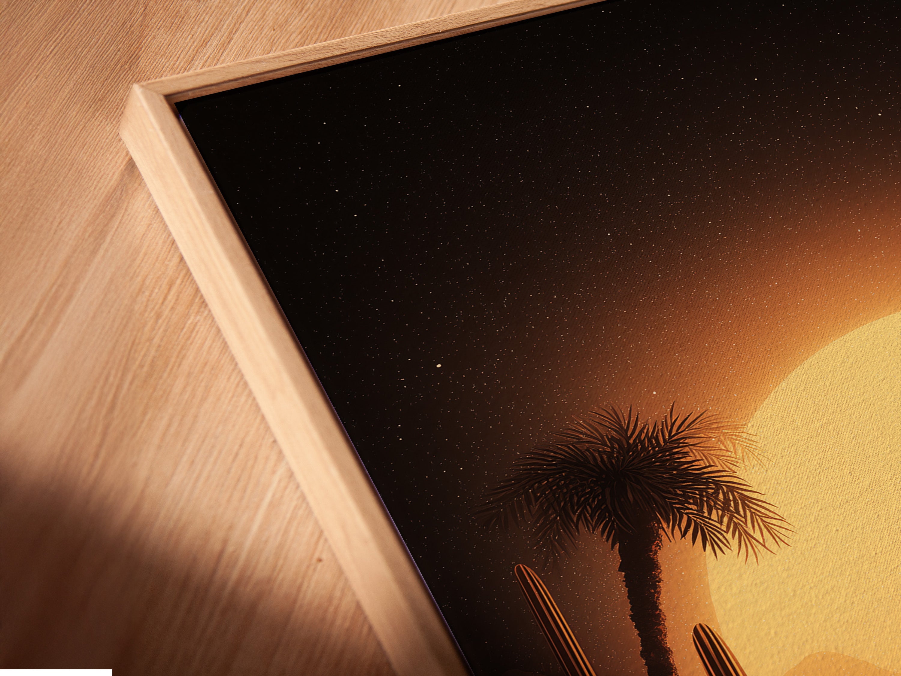 Angled close up of desert camel canvas print. The print is set in a floating frame. The warm golden landscape artwork is perfect for minimalist rustic or eclectic aesthetics.