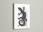 A white frame surrounds a striking art print. The black gecko artwork stands out. The white frame is clean and modern. It enhances the artwork's appeal. This framed piece is a great addition to your decor.