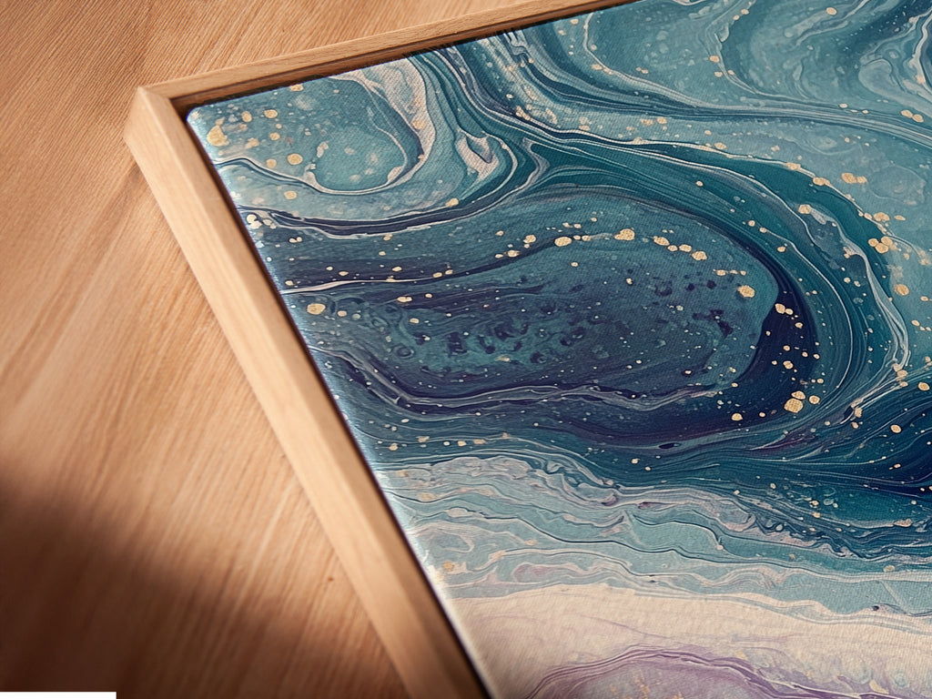 Close-up of an angled canvas print in a floating frame. The Abstract Ocean Wave artwork features teal and purple fluid art. This contemporary coastal decor piece offers a modern touch. The floating frame enhances the art creating a stunning visual effect. Perfect for adding elegance to any room