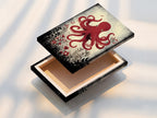 A stretched canvas print of the red octopus artwork. This ready-to-hang option brings instant coastal charm. Perfect for homeowners and boutique owners. Add marine biology inspiration to your walls. Buy Now.