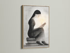 Minimalist woman reading art in an oak frame. This grayscale print is a thoughtful bookish gift. Ideal for reading corners it adds a touch of elegance. A perfect book lover gift for study room decor.