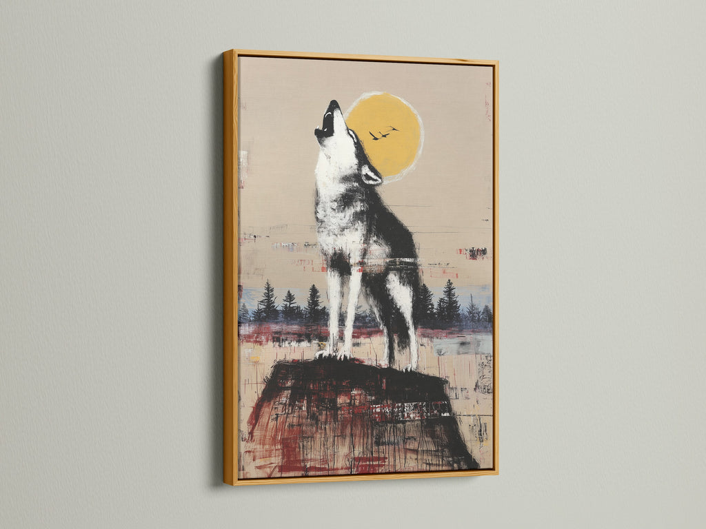 Rustic wildlife wall art featuring a howling wolf under the moon. The artwork is framed in a gold frame. Enhance your rustic decor with this unique animal canvas print. This howling wolf print will elevate your cabin wall decor.