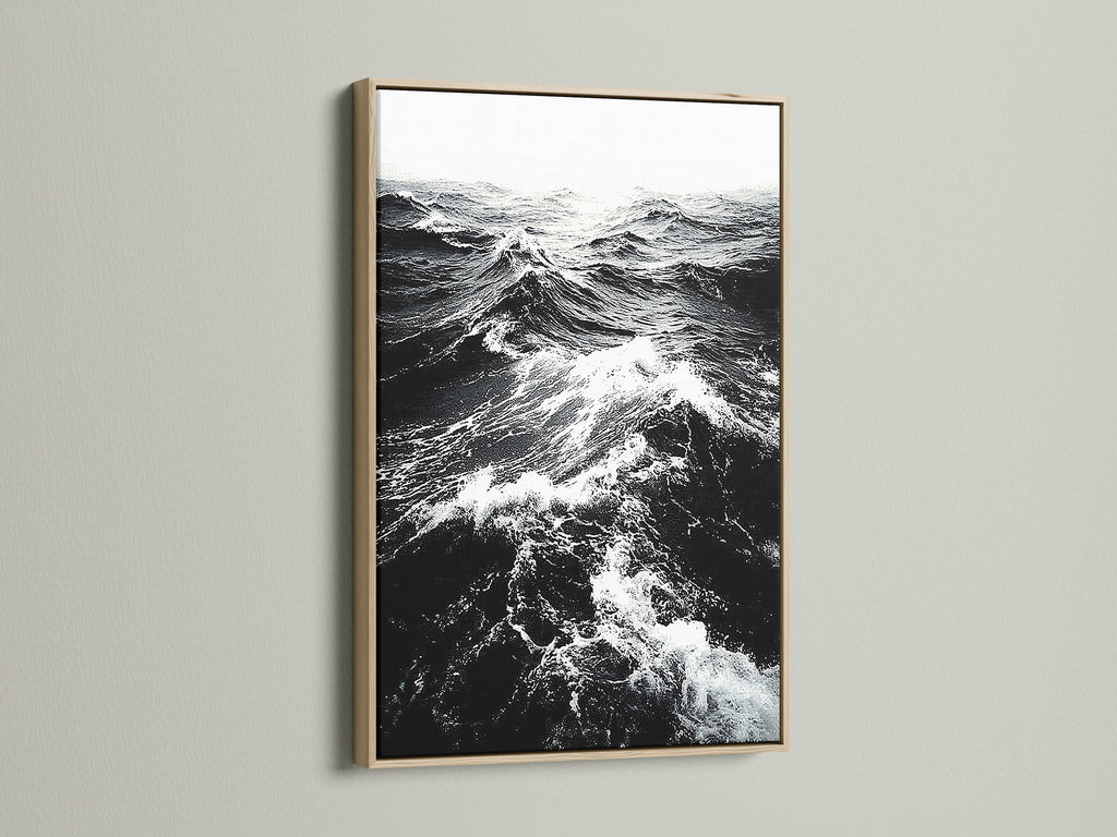 This is an oak frame displaying black and white ocean wave artwork. The natural wood grain adds warmth to monochrome art. Perfect nautical decor for a modern home. Discover seascape canvas prints now.