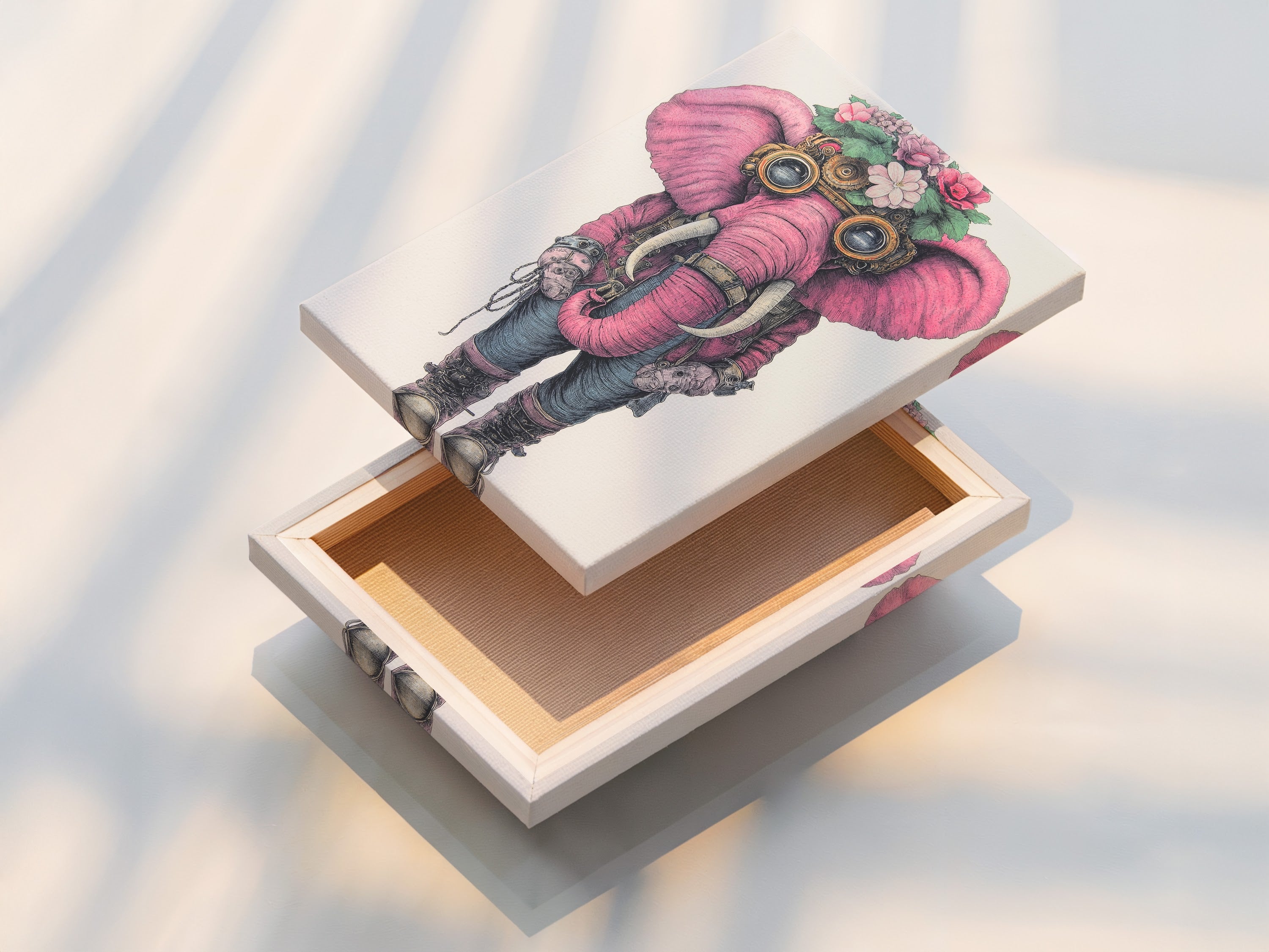 A stretched canvas print showcases a steampunk elephant artwork. The pink elephant art is adorned with floral details and steampunk goggles. This whimsical print is ready to hang adding character to any room.