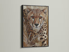 The cheetah portrait is presented in a sleek black frame. This enhances the modern feel of the animal portrait art. It is a sophisticated piece of safari wall decor. This cheetah canvas art brings a touch of the wild indoors.