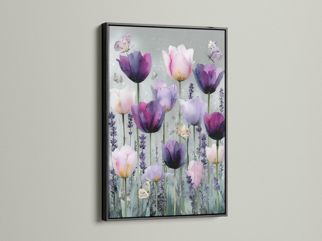 A striking artwork with a black frame. The artwork features pink and purple tulips. Butterflies add a delicate touch to the floral artwork. The black frame provides a bold contrast making the artwork pop. The art is displayed on a white wall creating a sophisticated look.