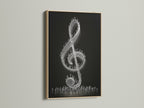 This musical wall decor features an oak frame. The black and white treble clef artwork stands out. It's ideal for a music studio or living room. The frame enhances the art's contemporary style. Elevate your space with this unique piece.
