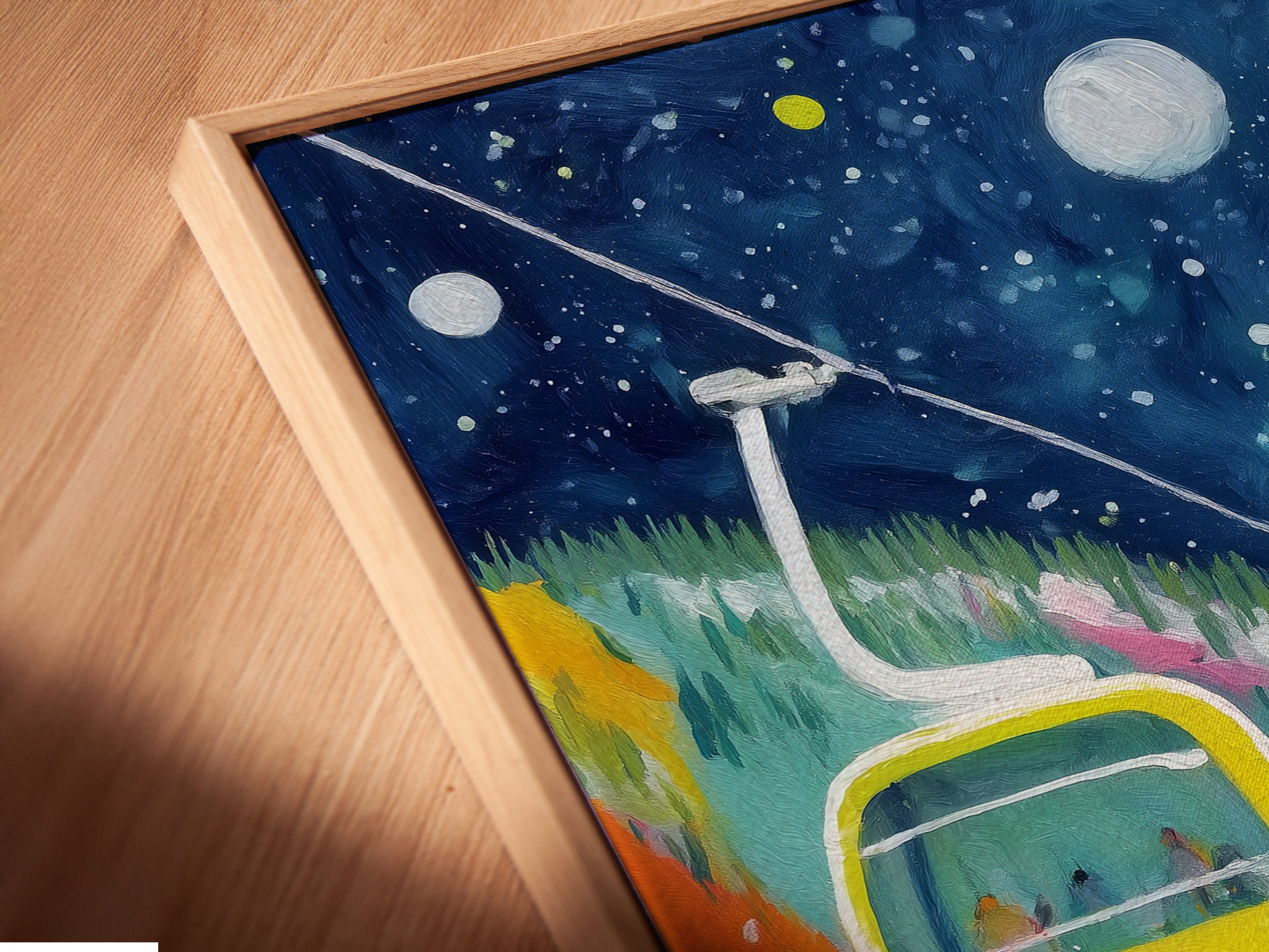 Close-up of a canvas print in a floating frame. The print showcases a vibrant winter mountain scene. The colorful ski art adds a modern touch. It's perfect for a ski lodge or mountain-themed space.