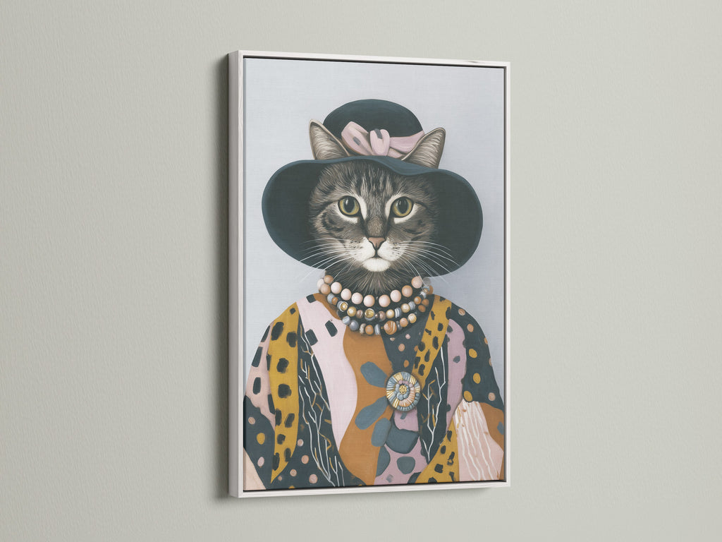 A dressed cat print displayed in a white frame. This whimsical wall art brings a smile to your face. The cat canvas print is perfect for a modern style. Add feline art to your living room.