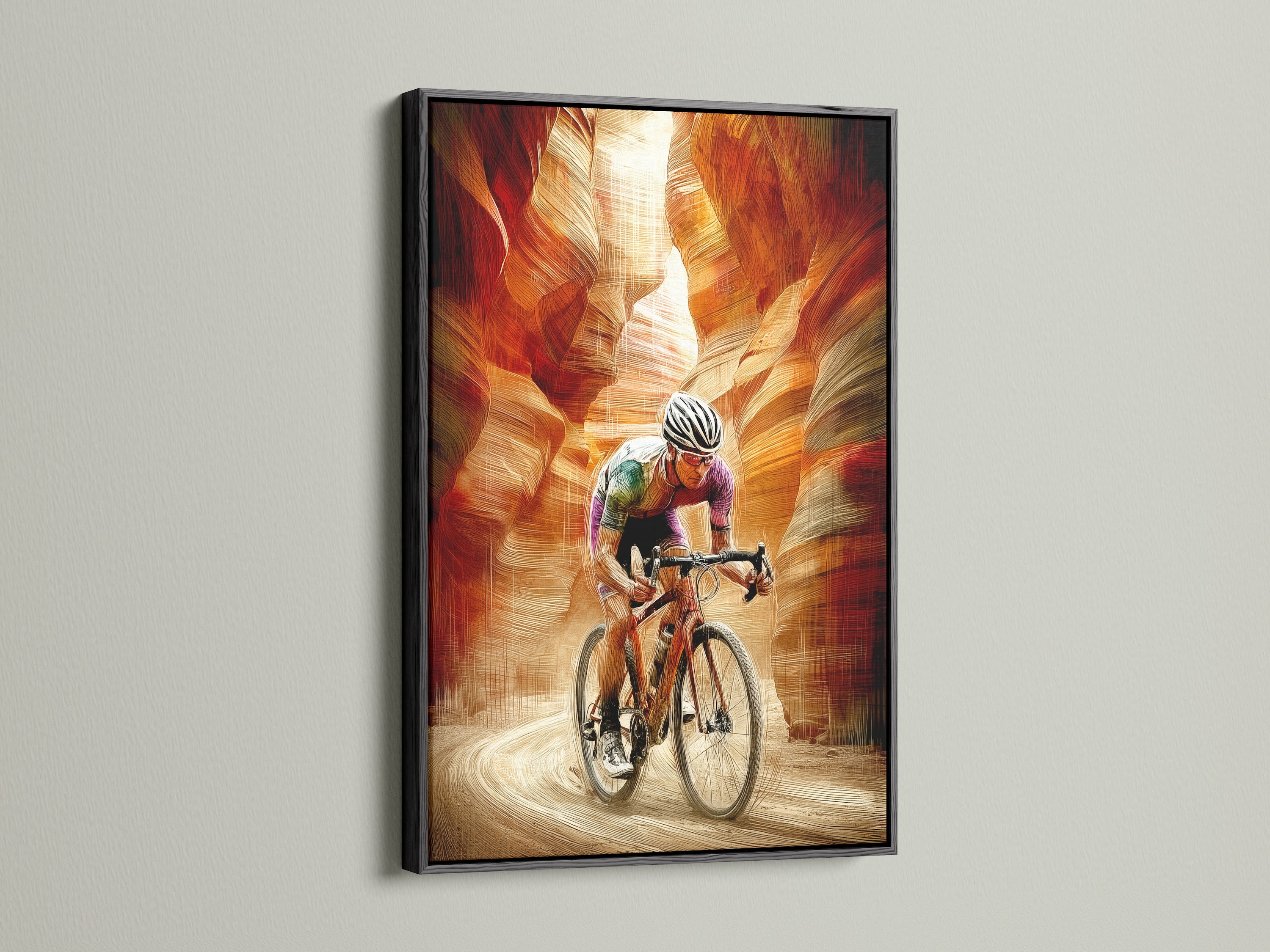 A cyclist art print framed in a sleek black frame. This endurance art shows a cyclist riding through a canyon. The black frame adds a bold touch. Ideal for a home gym or as motivational artwork in a studio or office.
